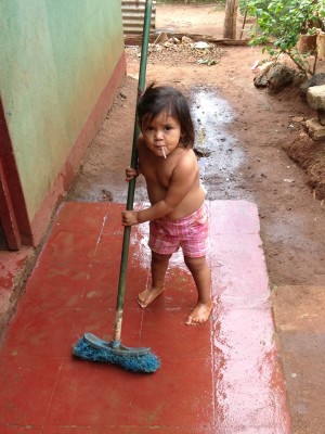Diana cleaning the front porch of the school