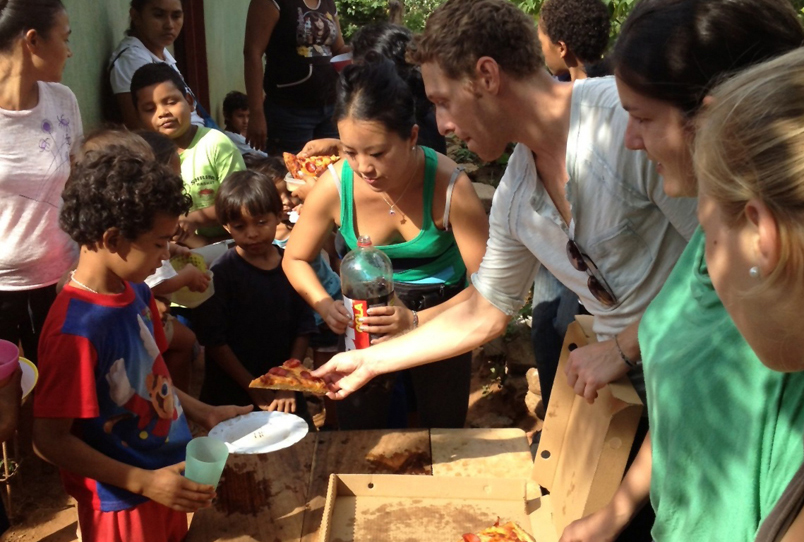Joel serving Pizza to the kids on Thanksgiving day, 2012